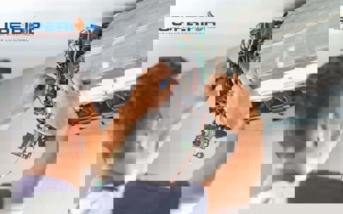 A technician repairs an air conditioner unit